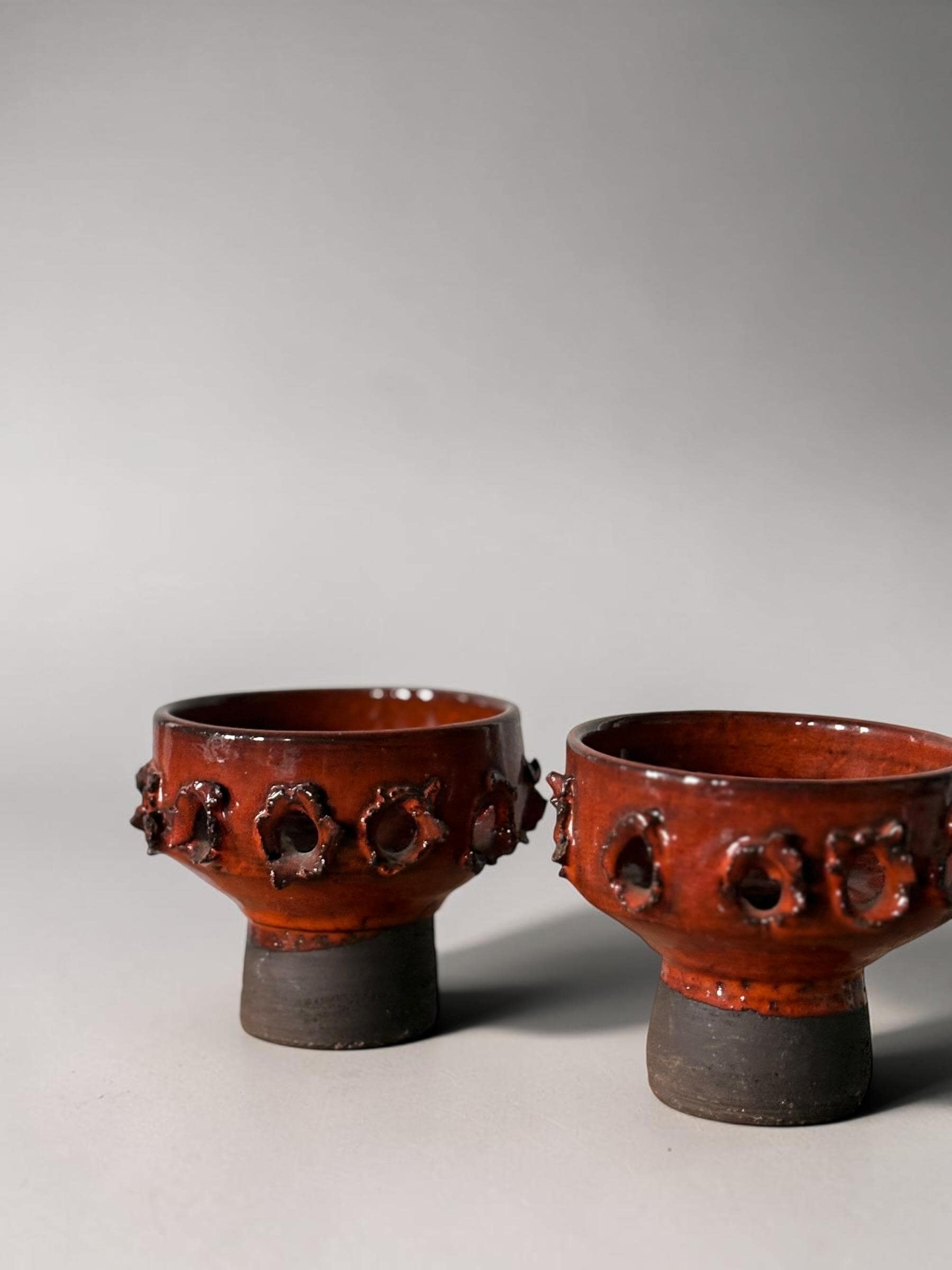 Brutalist studio ceramic candleholder pair in  pierced stoneware with orange red glaze __etsy:8163053513