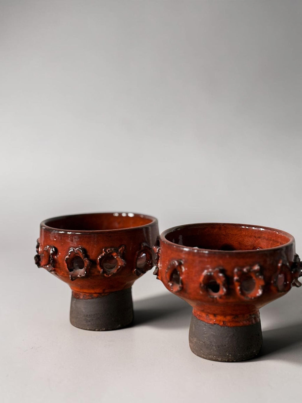 Brutalist studio ceramic candleholder pair in  pierced stoneware with orange red glaze __etsy:8163053519